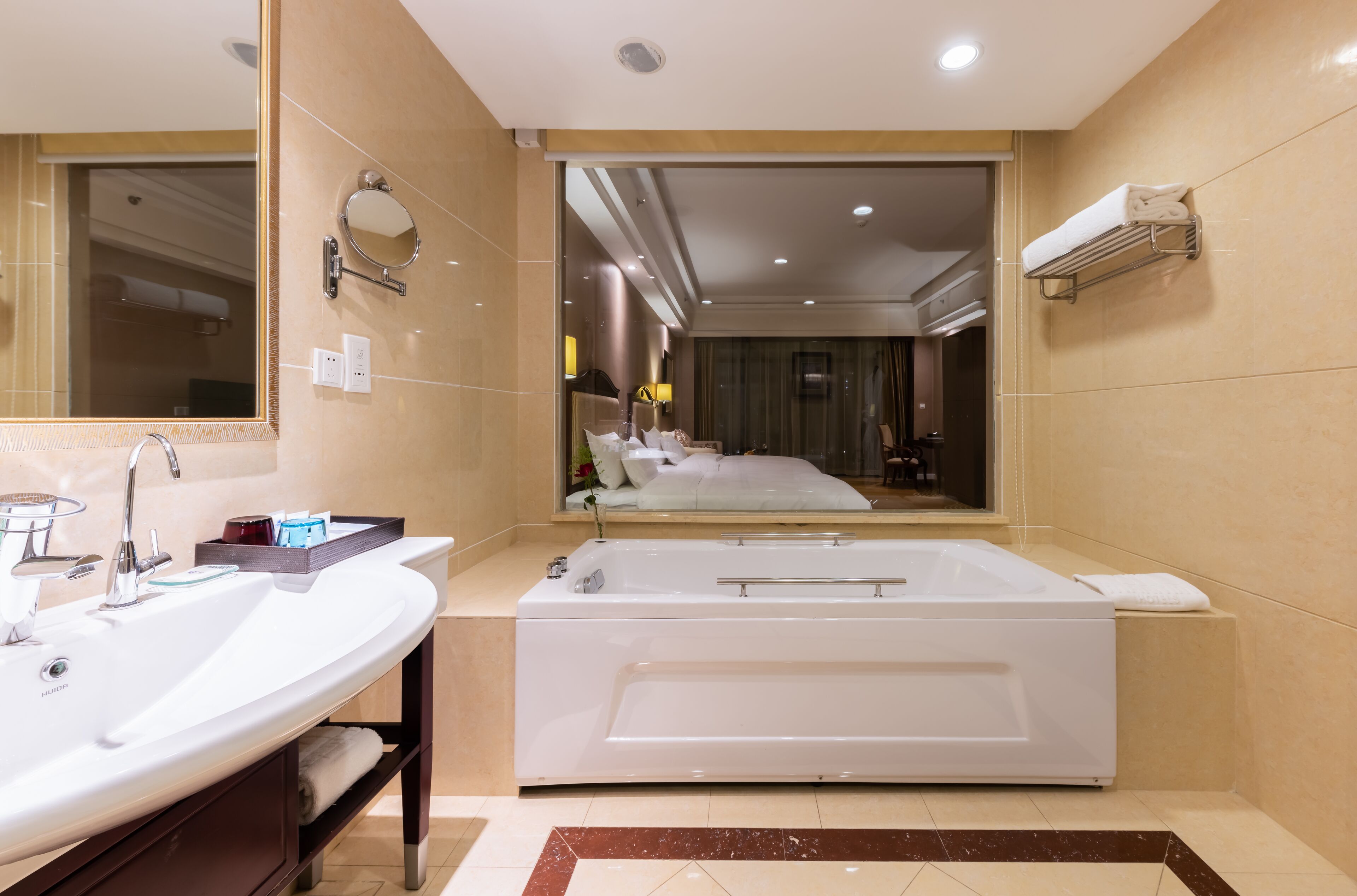 deluxe twin bedroom | bathroom | separate bathtub and shower, deep-soaking bathtub, rainfall showerhead