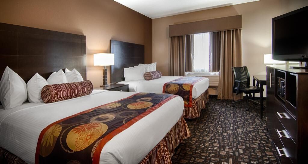 Desk, blackout drapes, iron/ironing board, rollaway beds