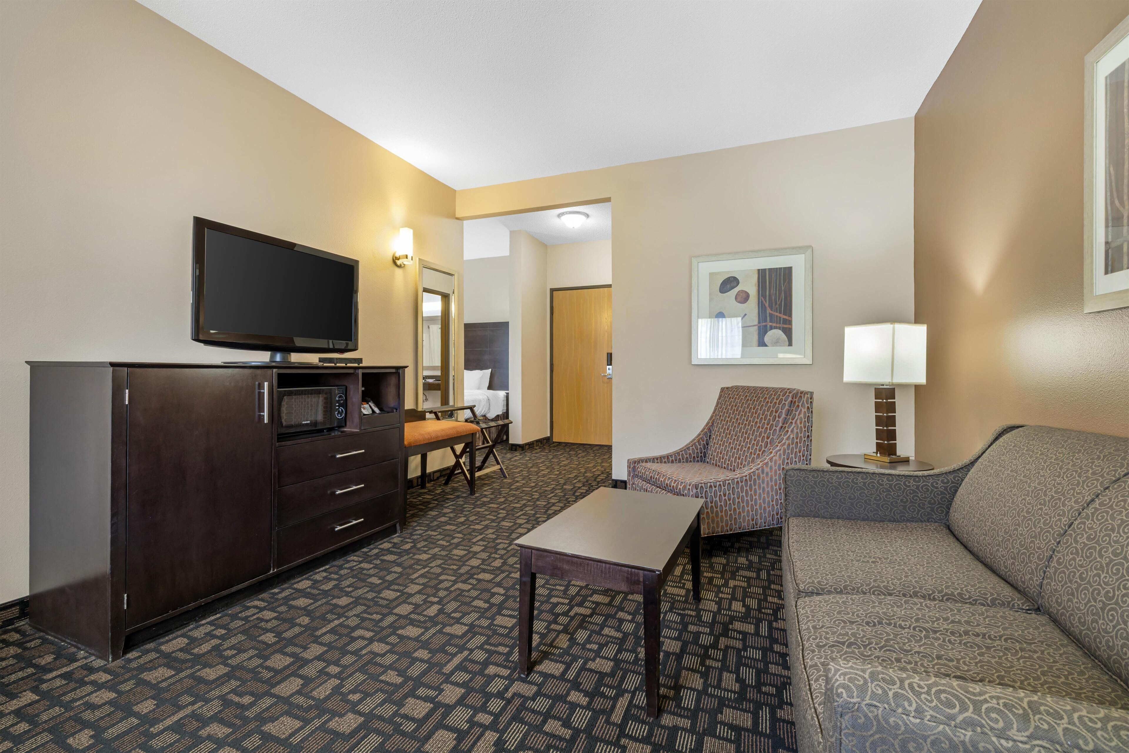 Desk, blackout drapes, iron/ironing board, rollaway beds