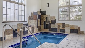 An indoor swimming pool with tiled walls and windows. - Best Western Plover-Stevens Point Hotel & Conference Center (Plover)