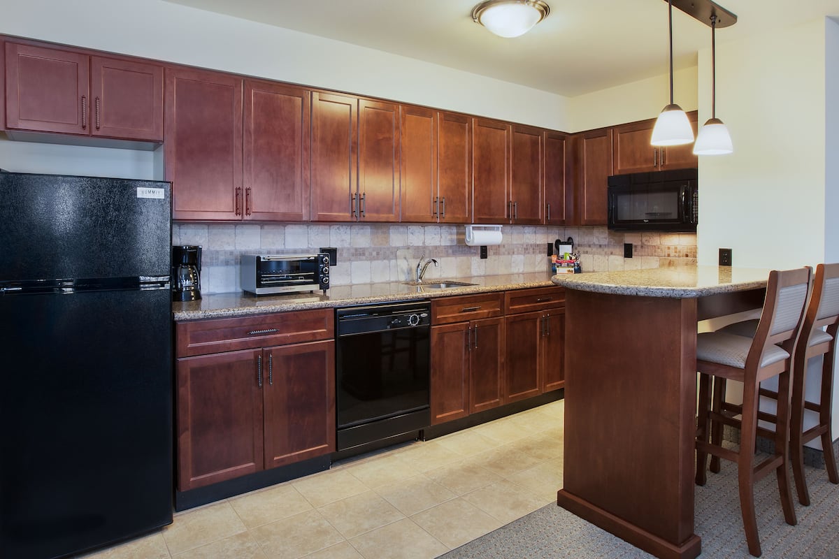 full-sized fridge, microwave, stovetop, dishwasher