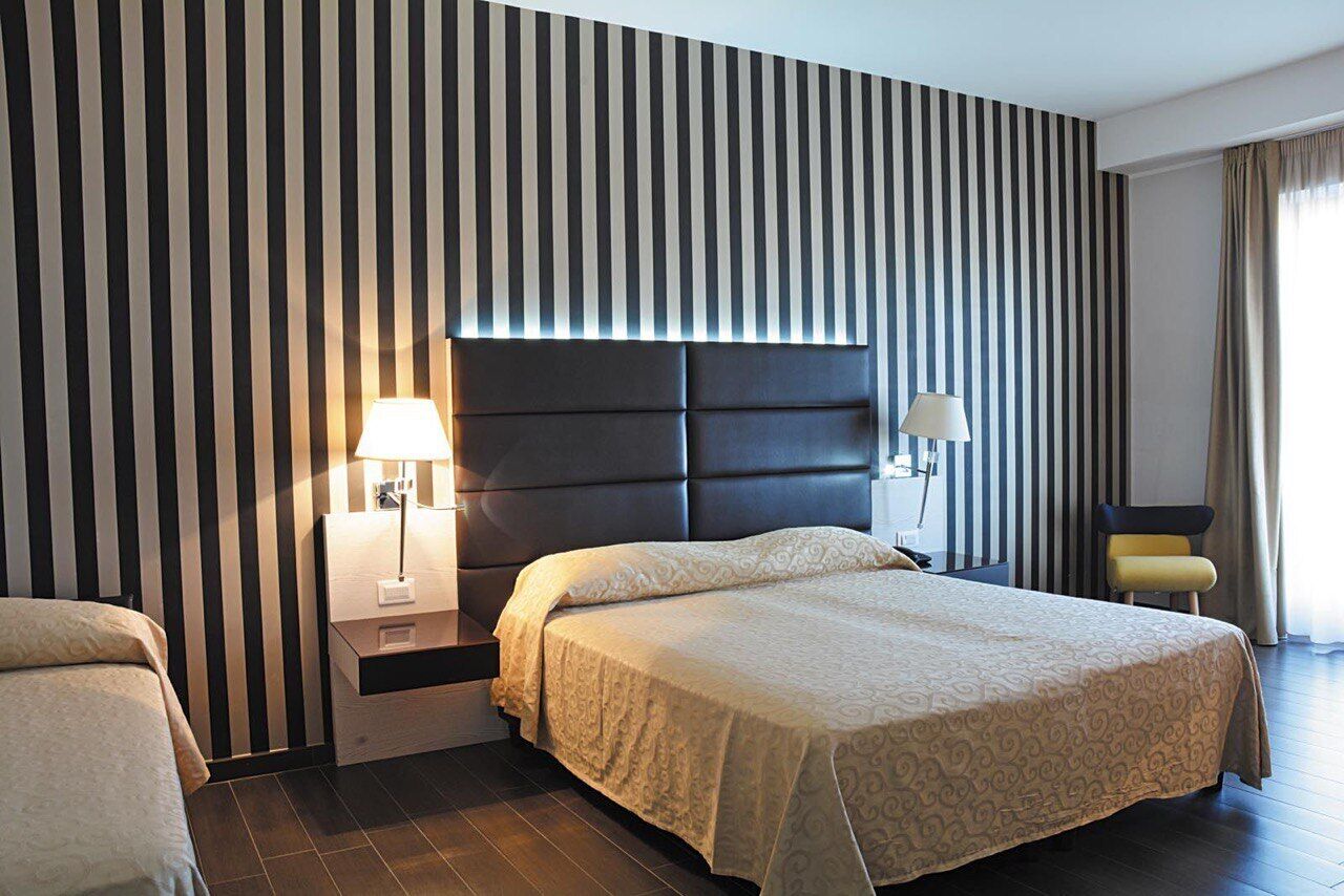 Deluxe Triple Room, Multiple Beds, Mobility Accessible | Premium bedding, minibar, in-room safe, desk