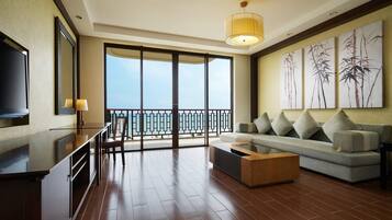Suite, 1 Bedroom, Balcony, Beachfront | Living room | LED TV, DVD player, pay films