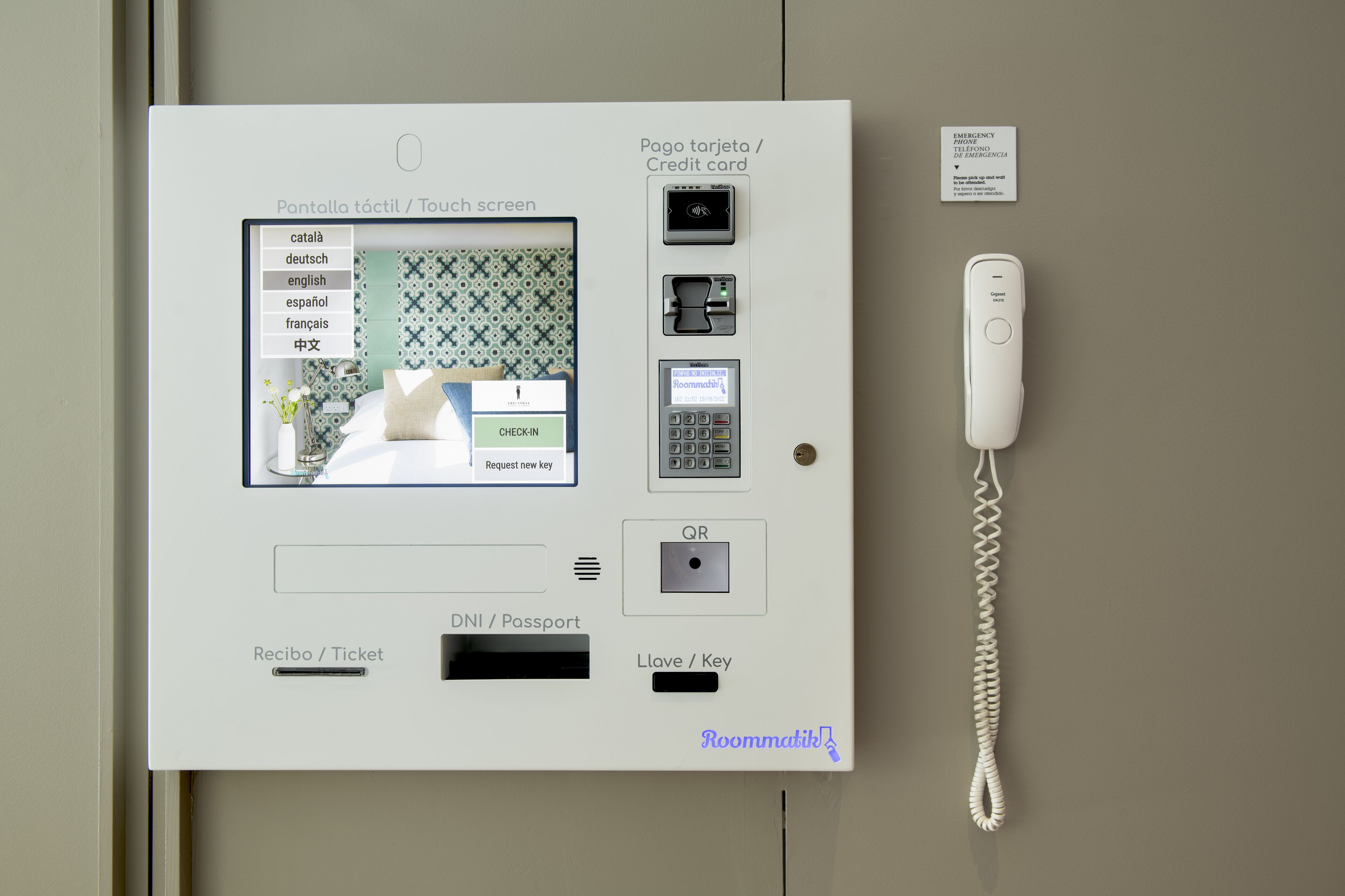A room service panel with a touch screen interface, payment options, and a keycard reader.