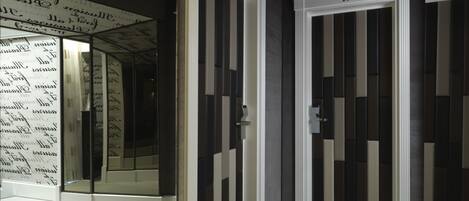 A hallway with doors numbered 101 and 102, leading to rooms.