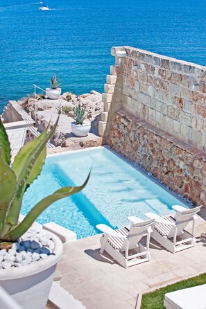 Seasonal outdoor pool, pool loungers