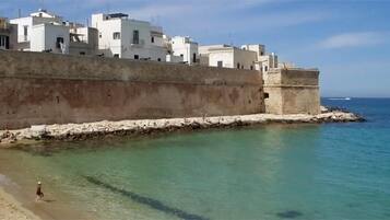 Stroll along the sea wall and enjoy breathtaking views of the calm blue sea.