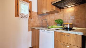 Bungalow, 2 Bedrooms | Private kitchen | Fridge, stovetop, cookware/dishes/utensils, freezer