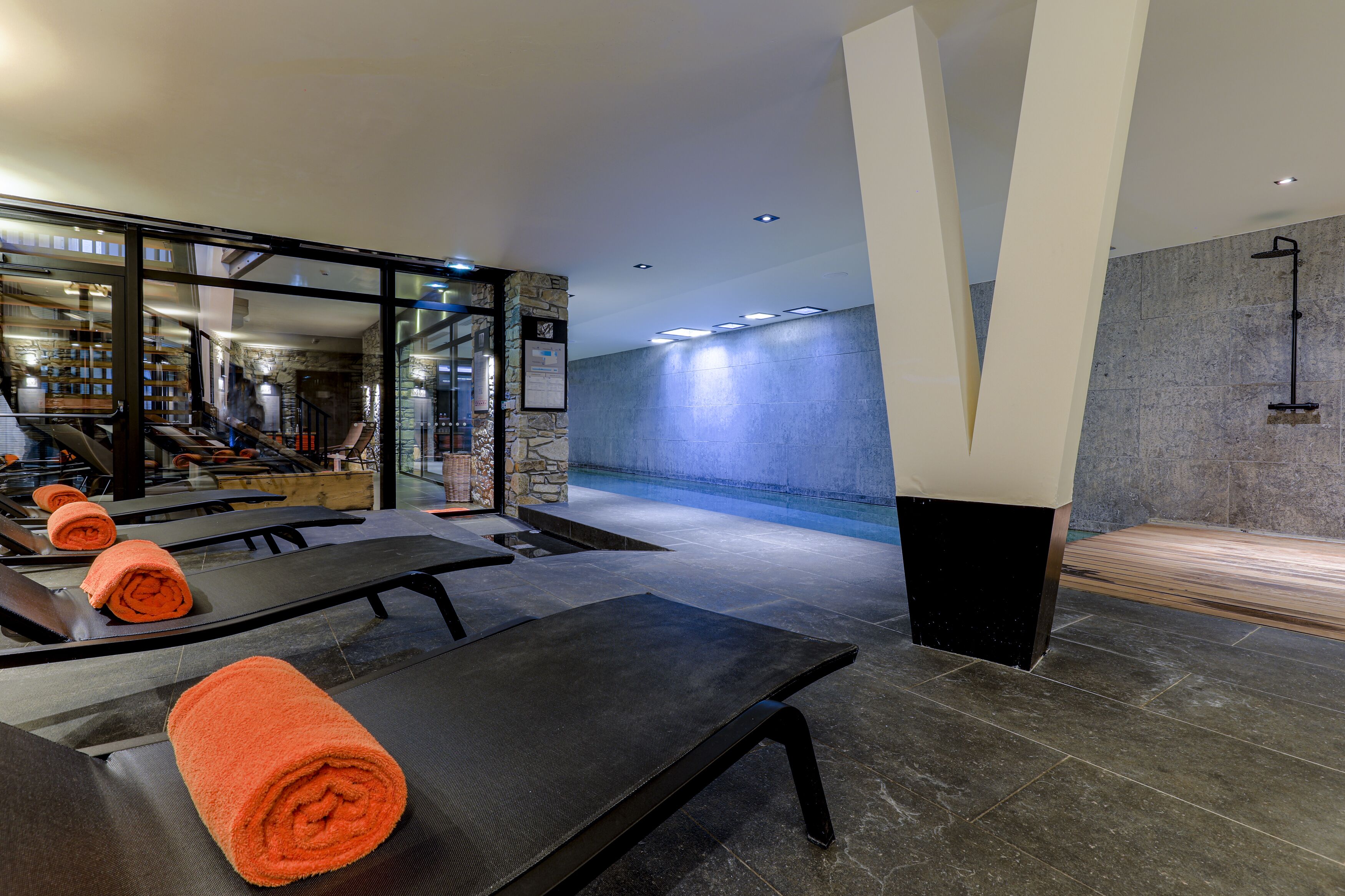 indoor pool, open 9:00 am to 8:00 pm, pool loungers