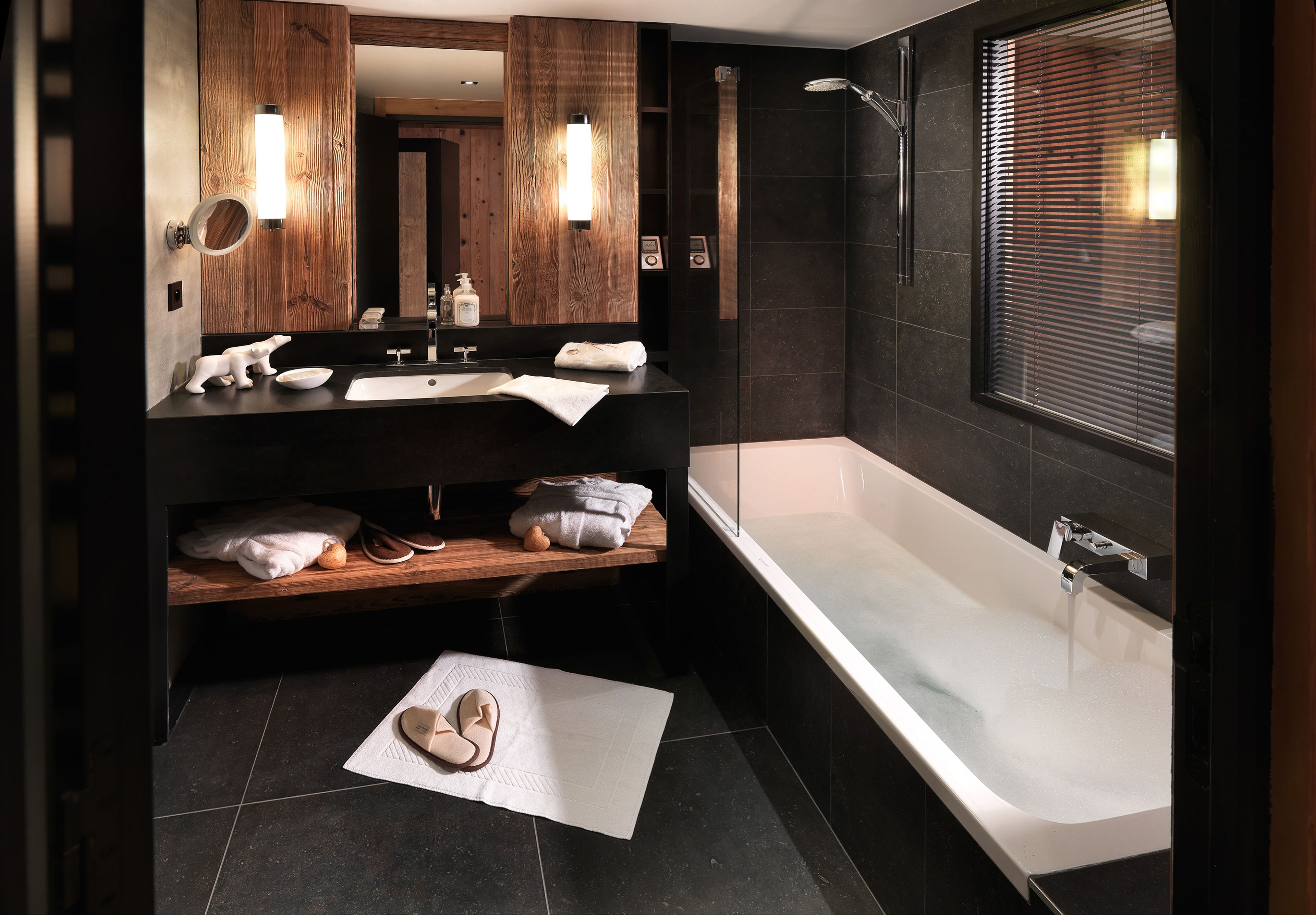deluxe double room | bathroom | rainfall showerhead, designer toiletries, hair dryer, bathrobes