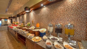A buffet with various food items and drink dispensers. - Sunday Marina View Hotel Apartments (Dubai)