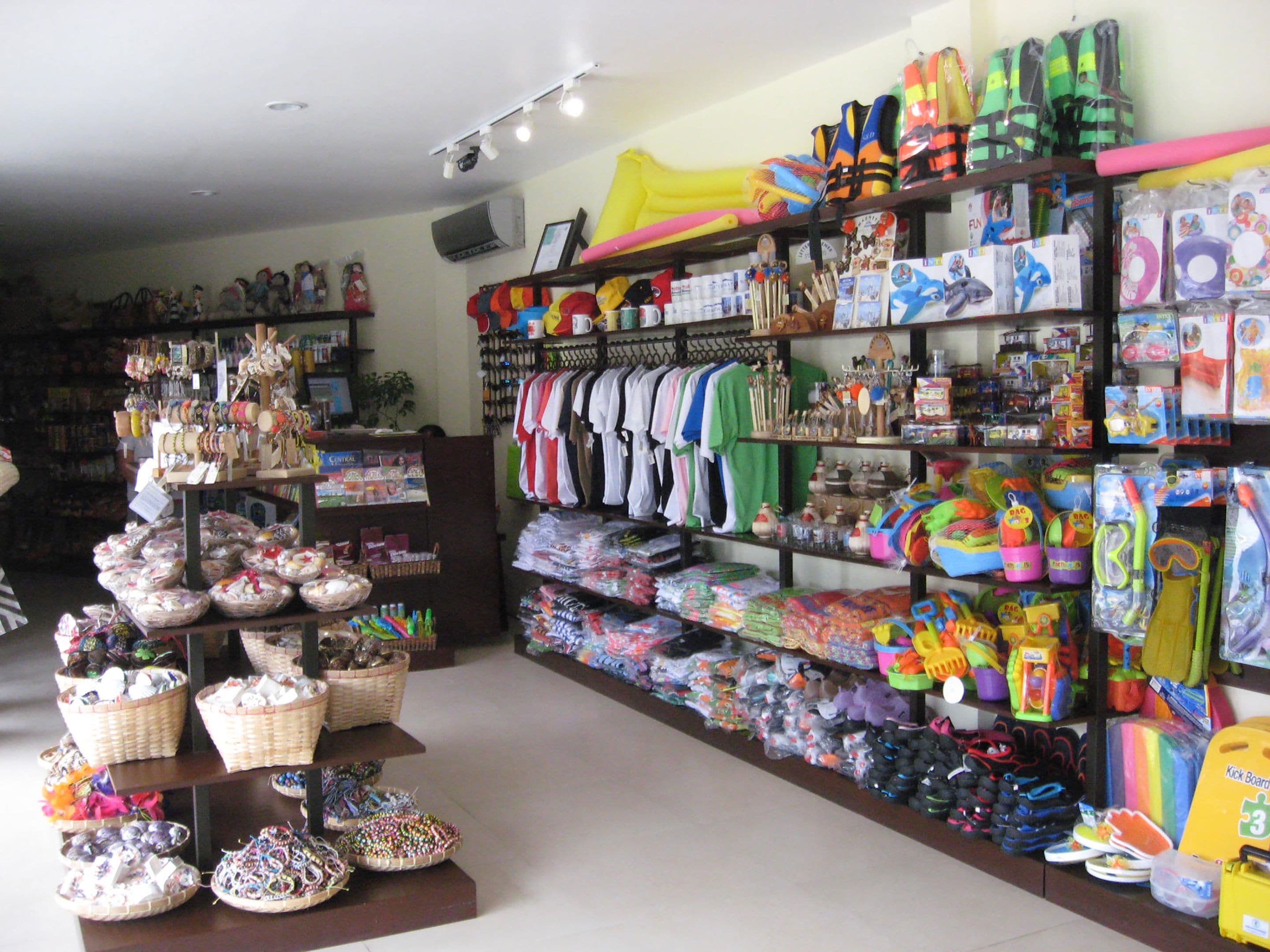 A store with shelves stocked with children's toys, clothing, and accessories.