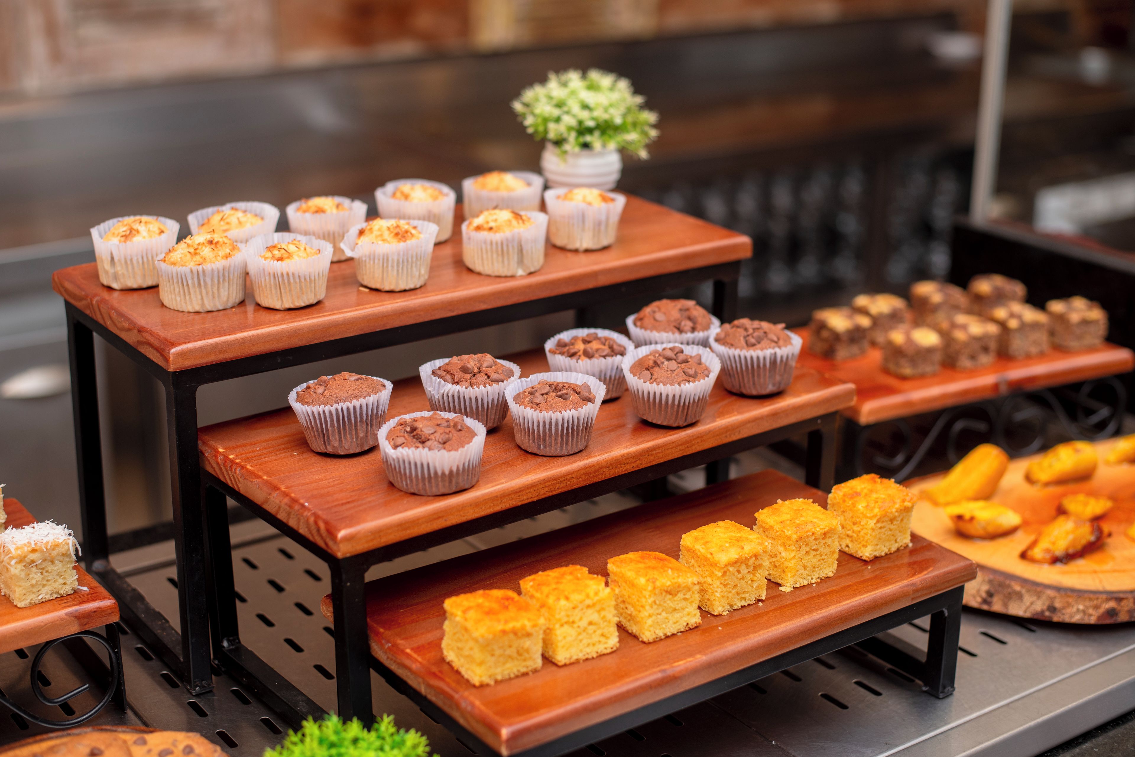 A display of various baked goods on a wooden stand.