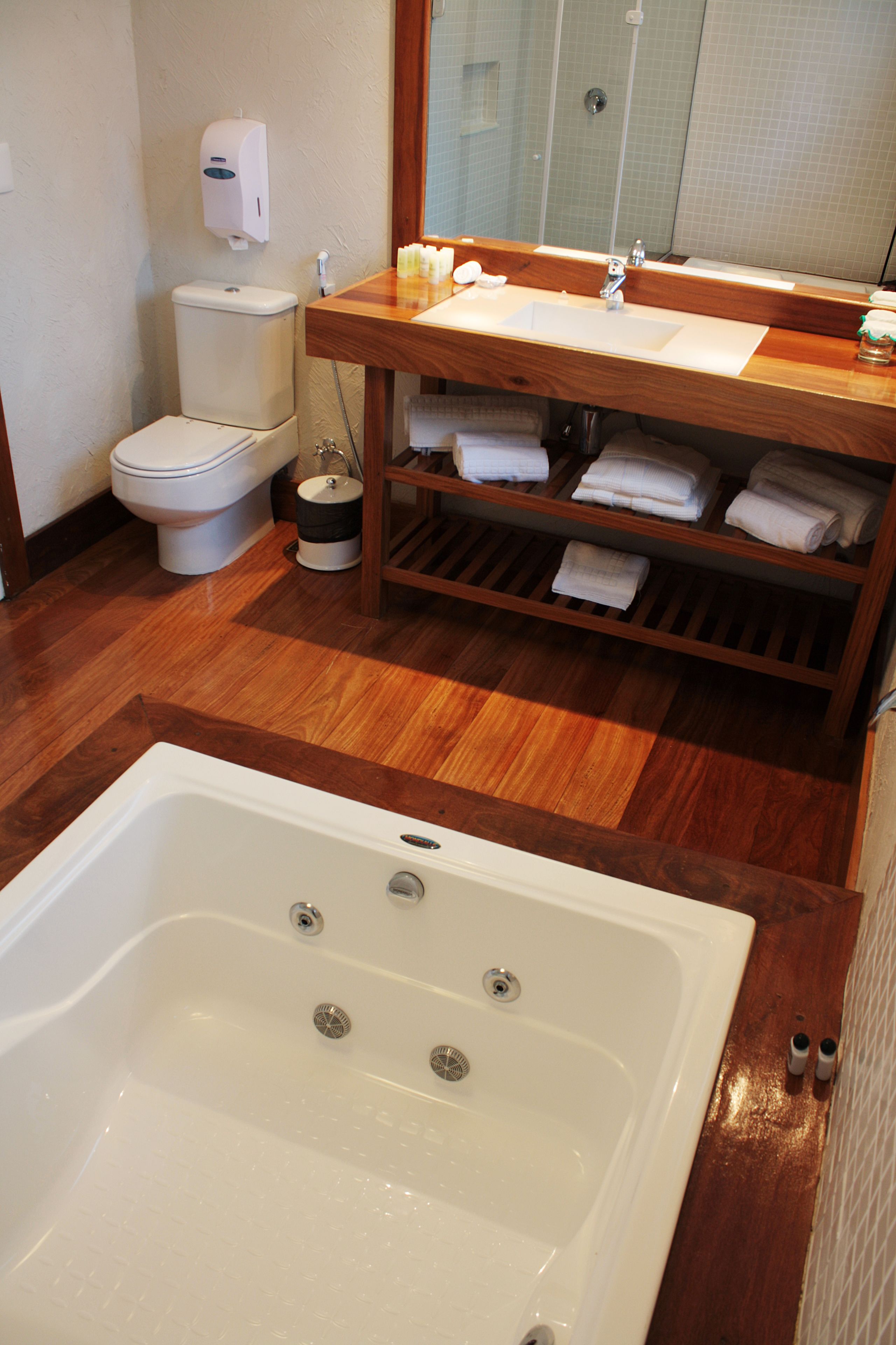 family room, 1 king bed, hot tub, pool view | bathroom | shower, hair dryer, bidet, towels