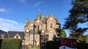 A historic building with a large gate and a sign for The Black Watch Castle & Museum. - Rosebank Guest House (Perth)