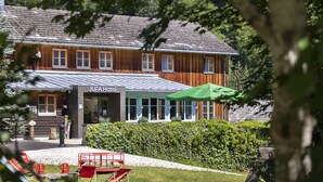 A wooden building with a sign reading "JUFA Hotel".