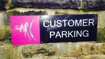 A sign indicating customer parking.
