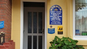 A hotel entrance with a sign reading "The Bianca" and a guest house sign. - Bianca Guesthouse (Blackpool)