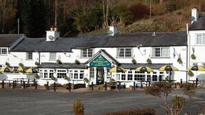 A white building with a sign reading "Britannia Inn."