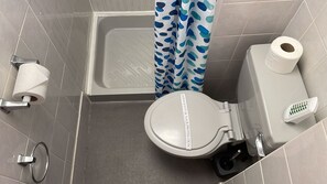 Shower, free toiletries, hair dryer, slippers