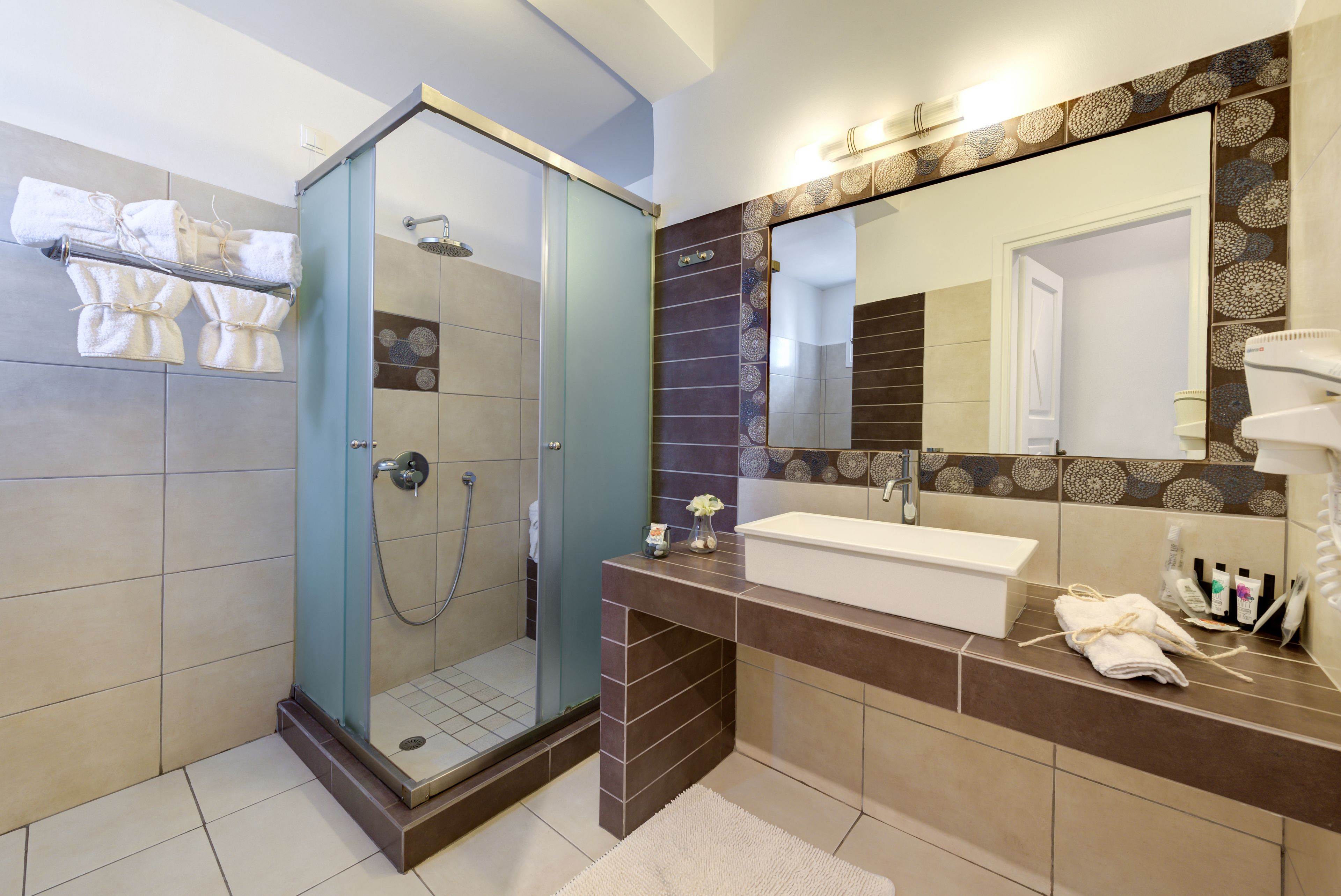 designer toiletries, hair dryer, bathrobes, slippers