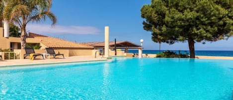 Seasonal outdoor pool, open 9:00 AM to 7:00 PM, sun loungers