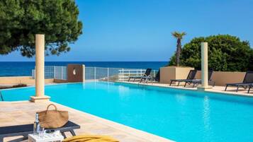 Seasonal outdoor pool, open 9:00 AM to 7:00 PM, sun loungers