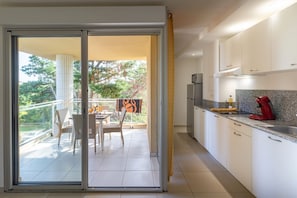 Standard Apartment, 1 Bedroom, Balcony | Living area | 80-cm TV with digital channels, table tennis