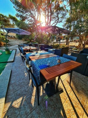 Breakfast, dinner served; local cuisine, pool views