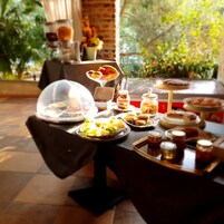 Breakfast, dinner served; local cuisine, pool views 