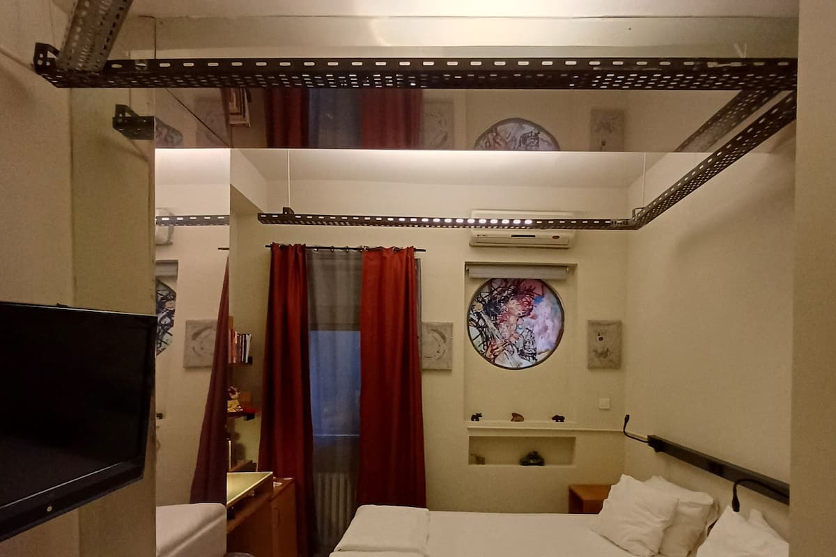 Corner Room with Brick Wall | Premium bedding, minibar, in-room safe, desk