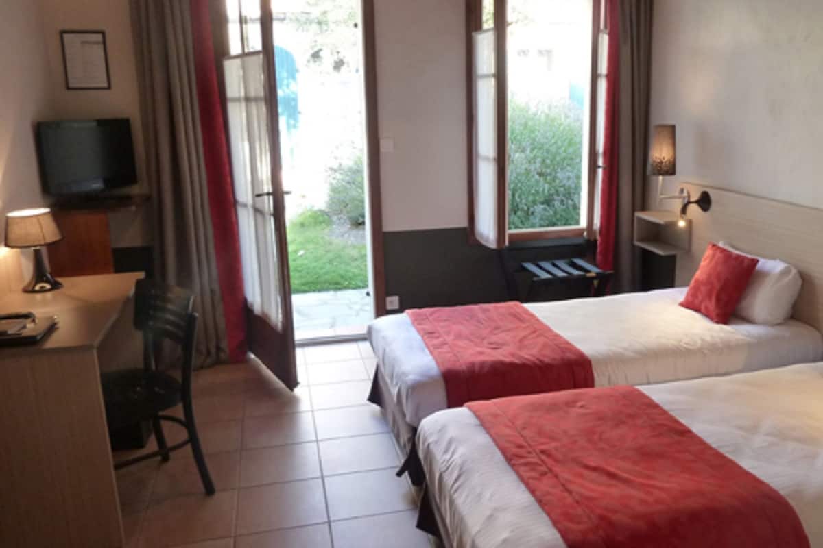 Twin Room, Garden Area | In-room safe, desk, free cots/infant beds, rollaway beds