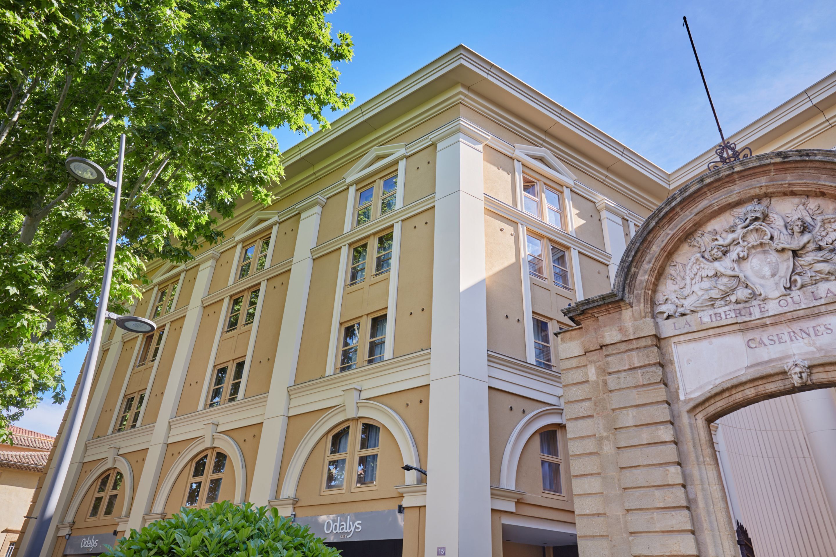 A historic building with classical architecture, featuring arched windows and a detailed facade.