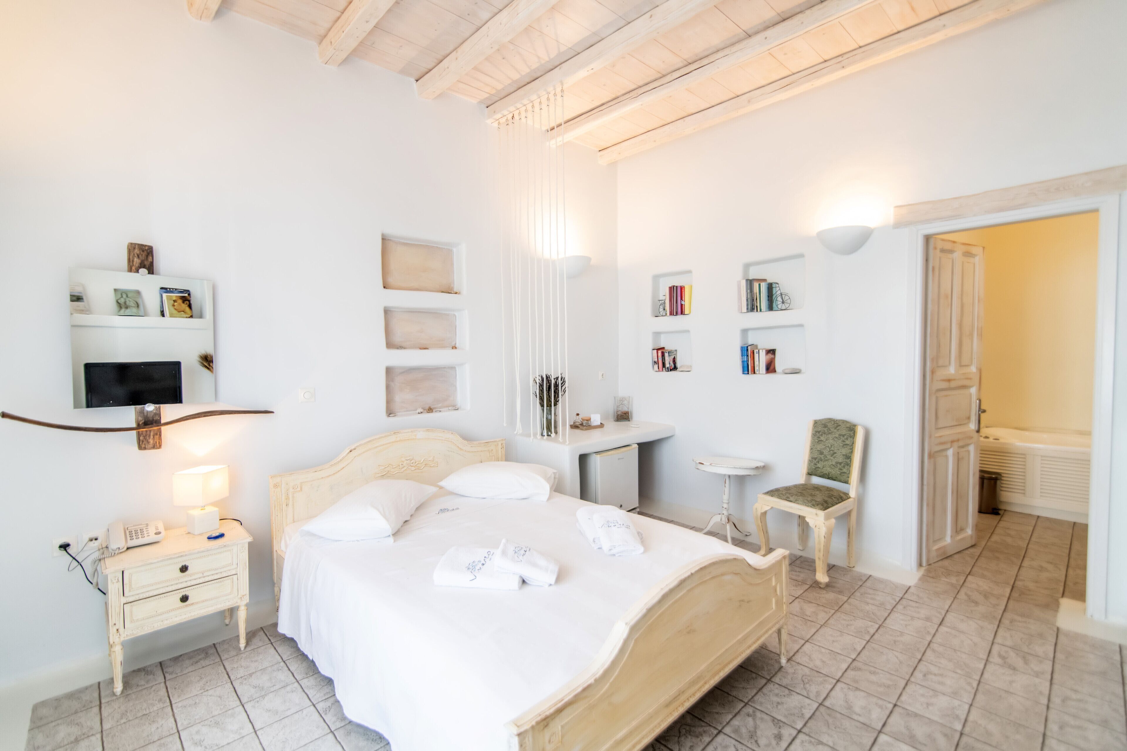 Premium bedding, down comforters, pillowtop beds, minibar
