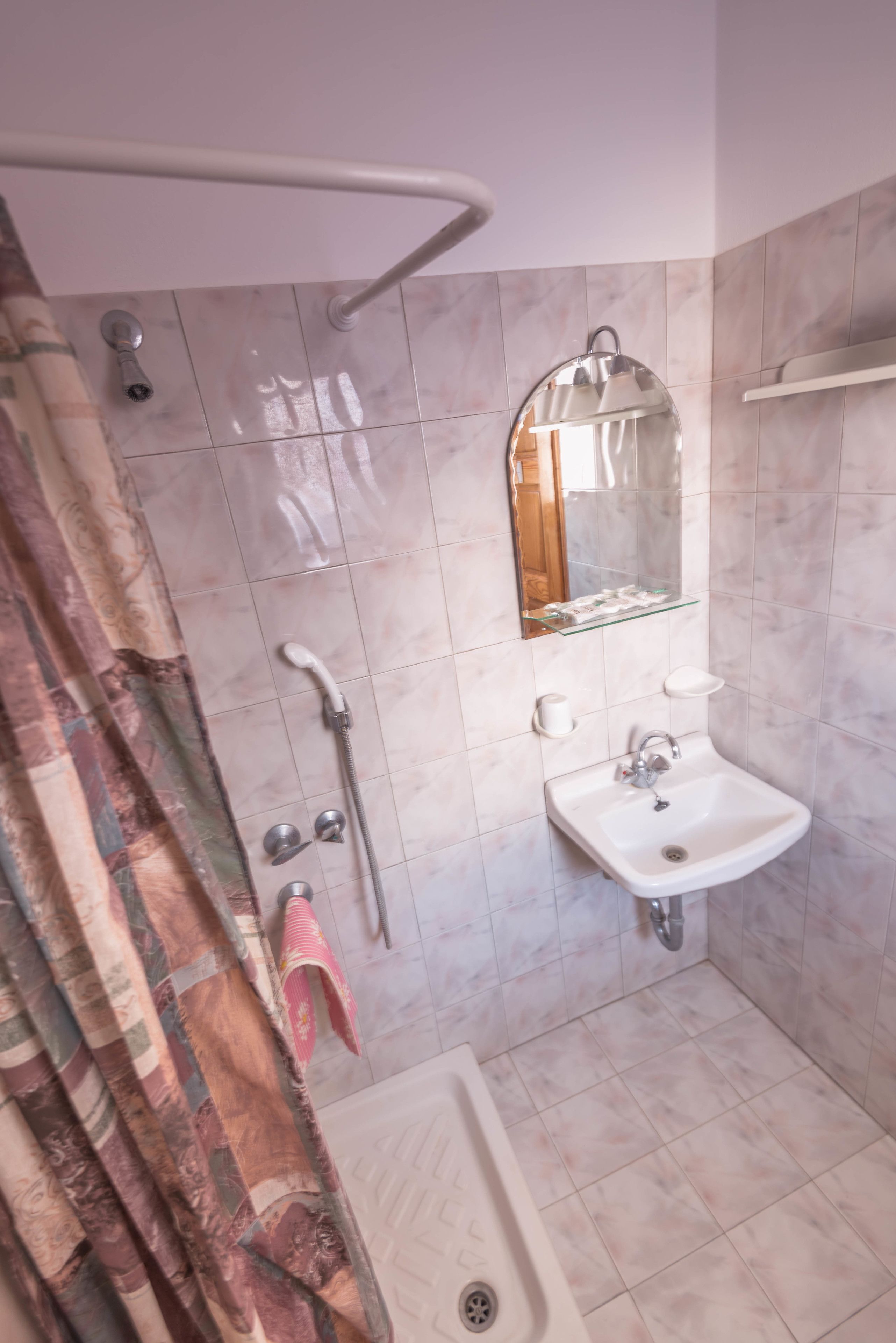 economy triple room | bathroom | combined shower/bathtub, towels
