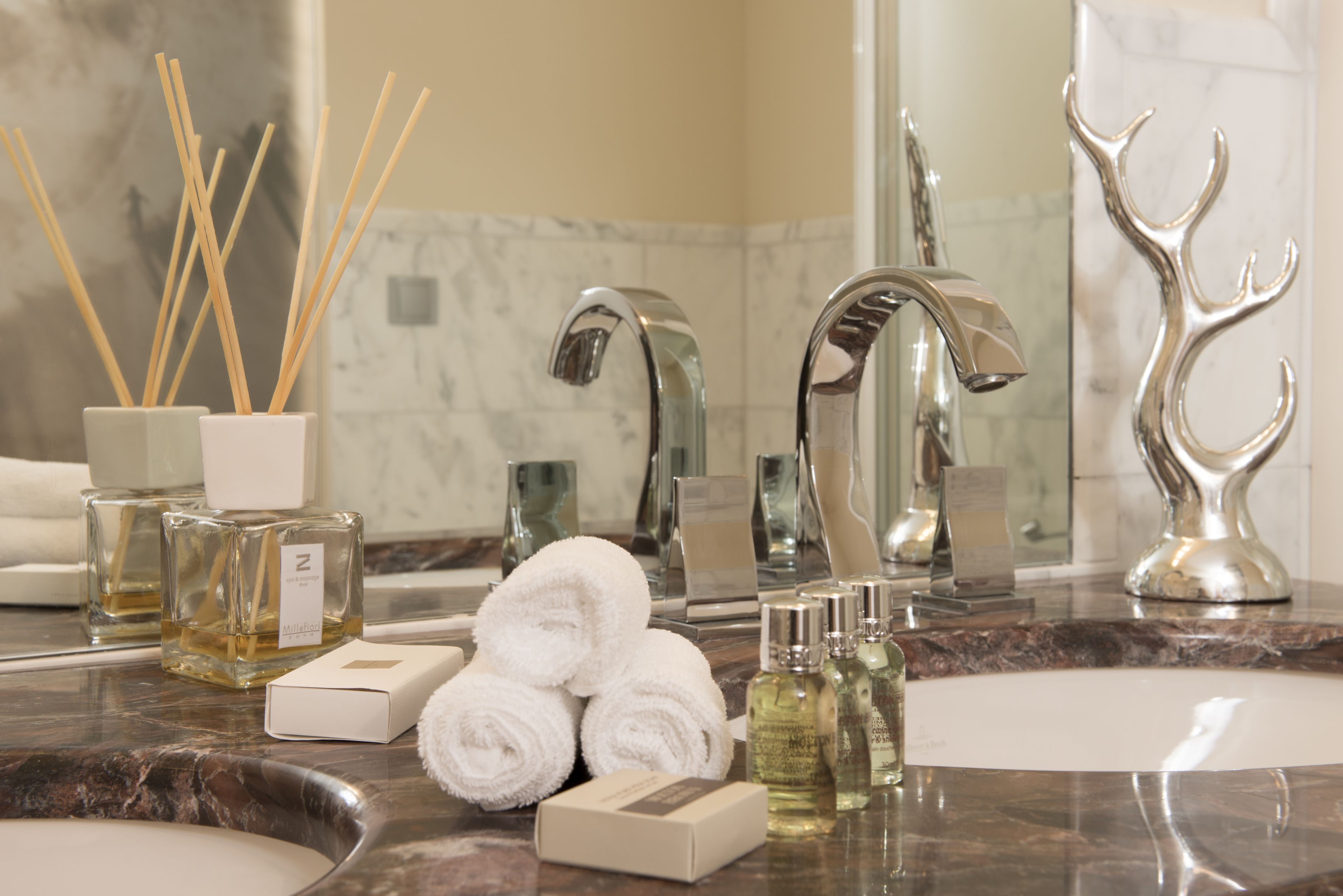 designer toiletries, hair dryer, dressing gowns, slippers