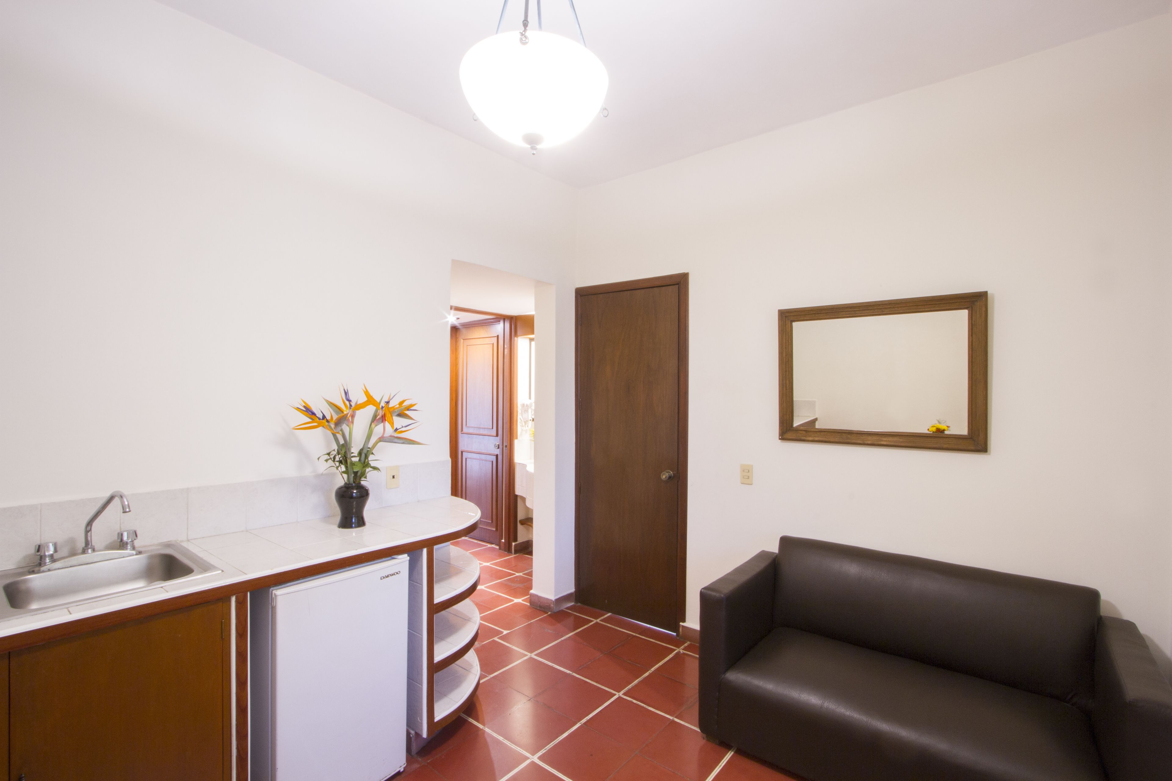 junior suite | living room | 32-inch flat-screen tv with satellite channels, tv, pay films