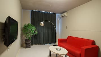 Desk, blackout drapes, iron/ironing board, free wired internet