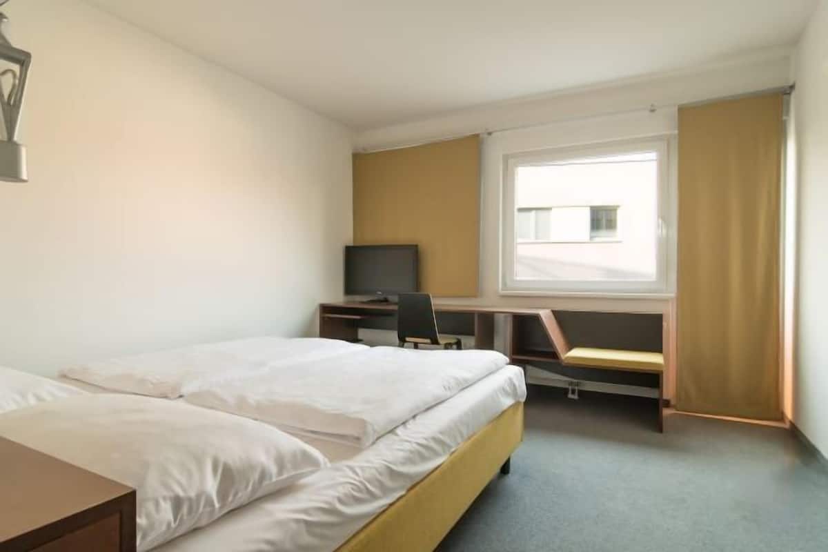 Hypo-allergenic bedding, blackout drapes, soundproofing, free WiFi