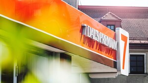 A building with a large sign reading "7 DAYS PREMIUM".