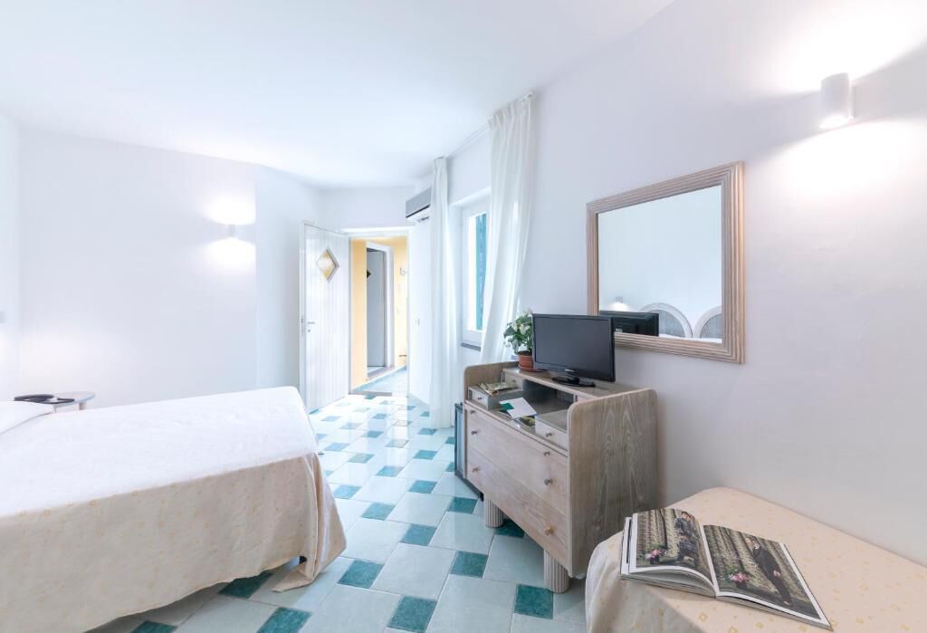 triple room | 1 bedroom, minibar, in-room safe, individually decorated