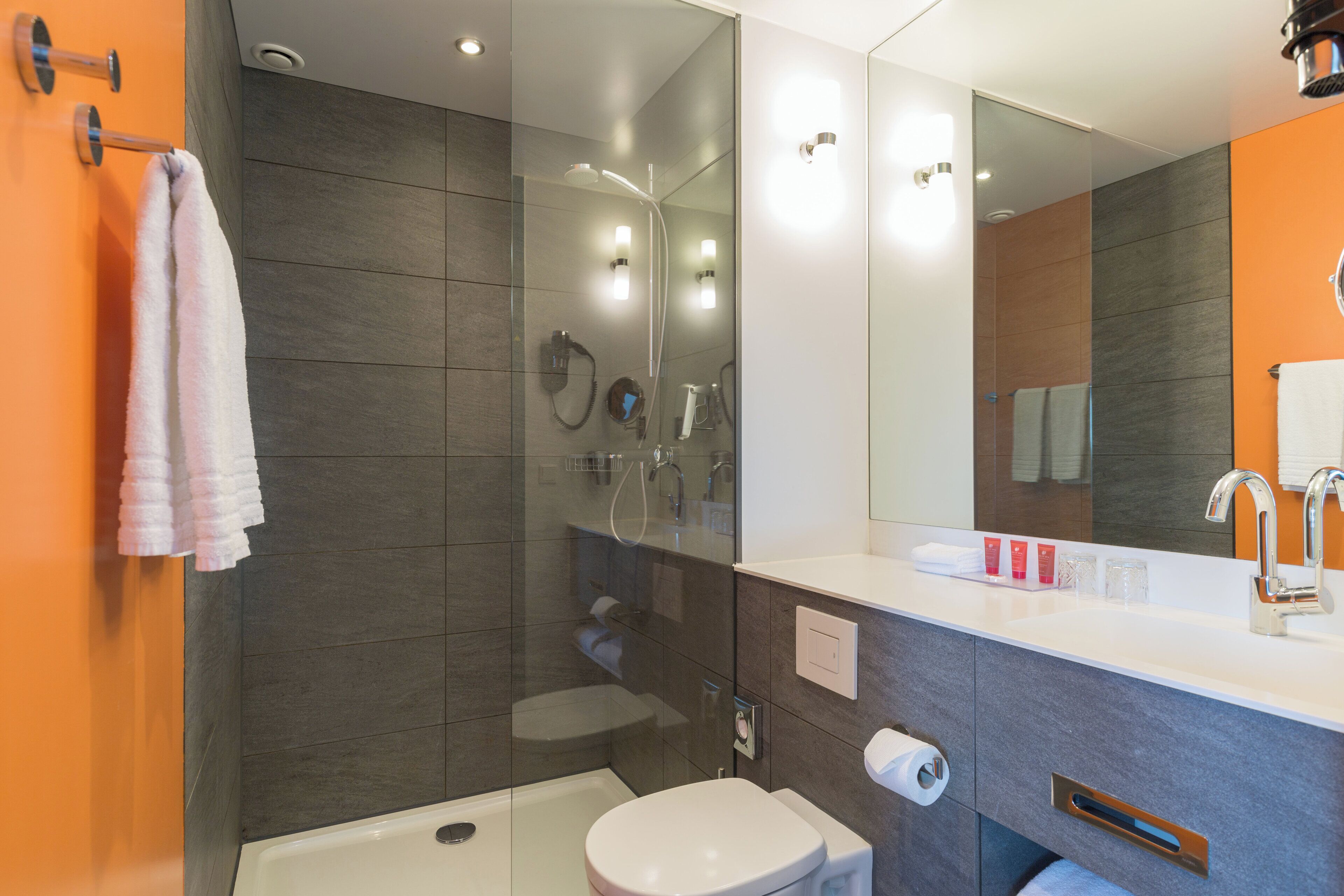 Shower, eco-friendly toiletries, hair dryer, towels