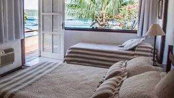 Panoramic Triple Room, Terrace | Minibar, in-room safe, blackout drapes, bed sheets