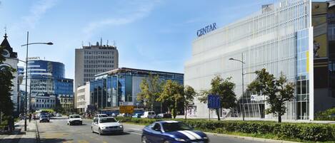 A modern building with a glass facade and the name "CENTAR" on the top.
