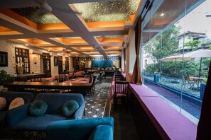 Breakfast, lunch, dinner served; international cuisine, pool views