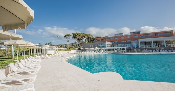 Indoor pool, outdoor pool, open 9:00 AM to 7:00 PM, pool umbrellas