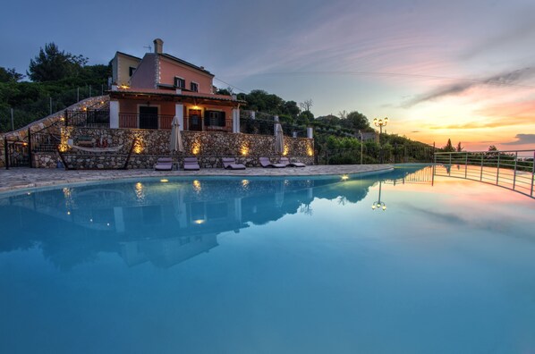 Seasonal outdoor pool, open 9:00 AM to 9:00 PM, pool umbrellas