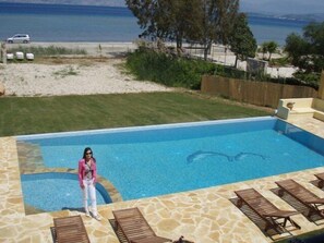 Seasonal outdoor pool, open 9:00 AM to 9:00 PM, pool umbrellas