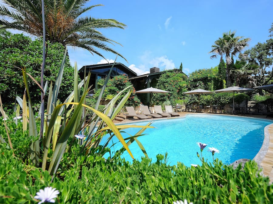 Seasonal outdoor pool, open 7:30 AM to 7:00 PM, pool umbrellas