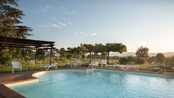 Seasonal outdoor pool, open 8 AM to 9 PM, pool umbrellas, sun loungers